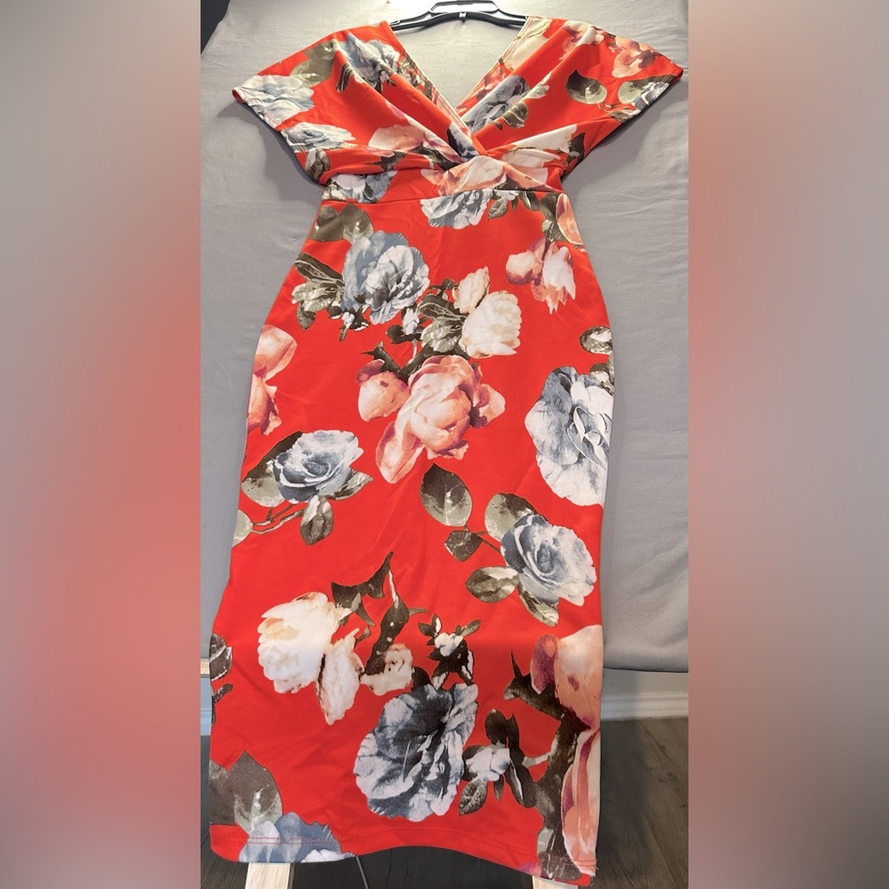Orange with flower designs very stretchy form fitting great condition size m